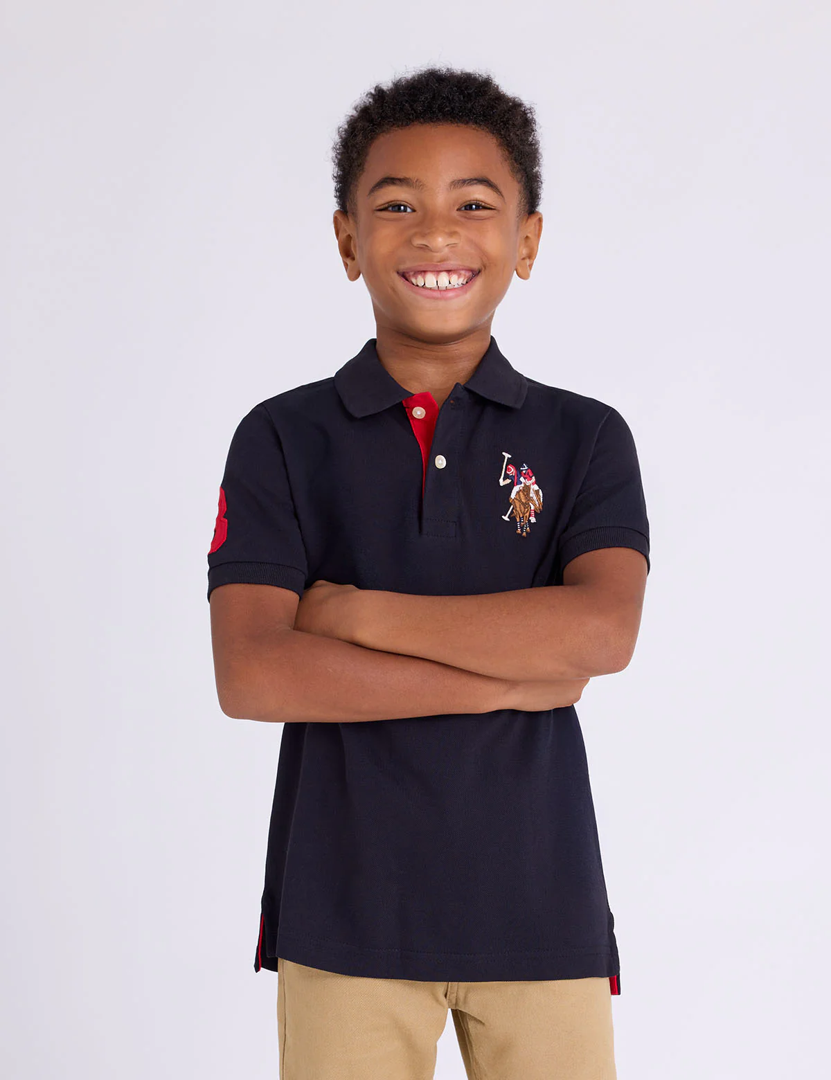 10694-boys-multi-color-logo-solid-pique-polo-shirt-1.webp BOYS MULTI COLOR LOGO SOLID PIQUE POLO SHIRT