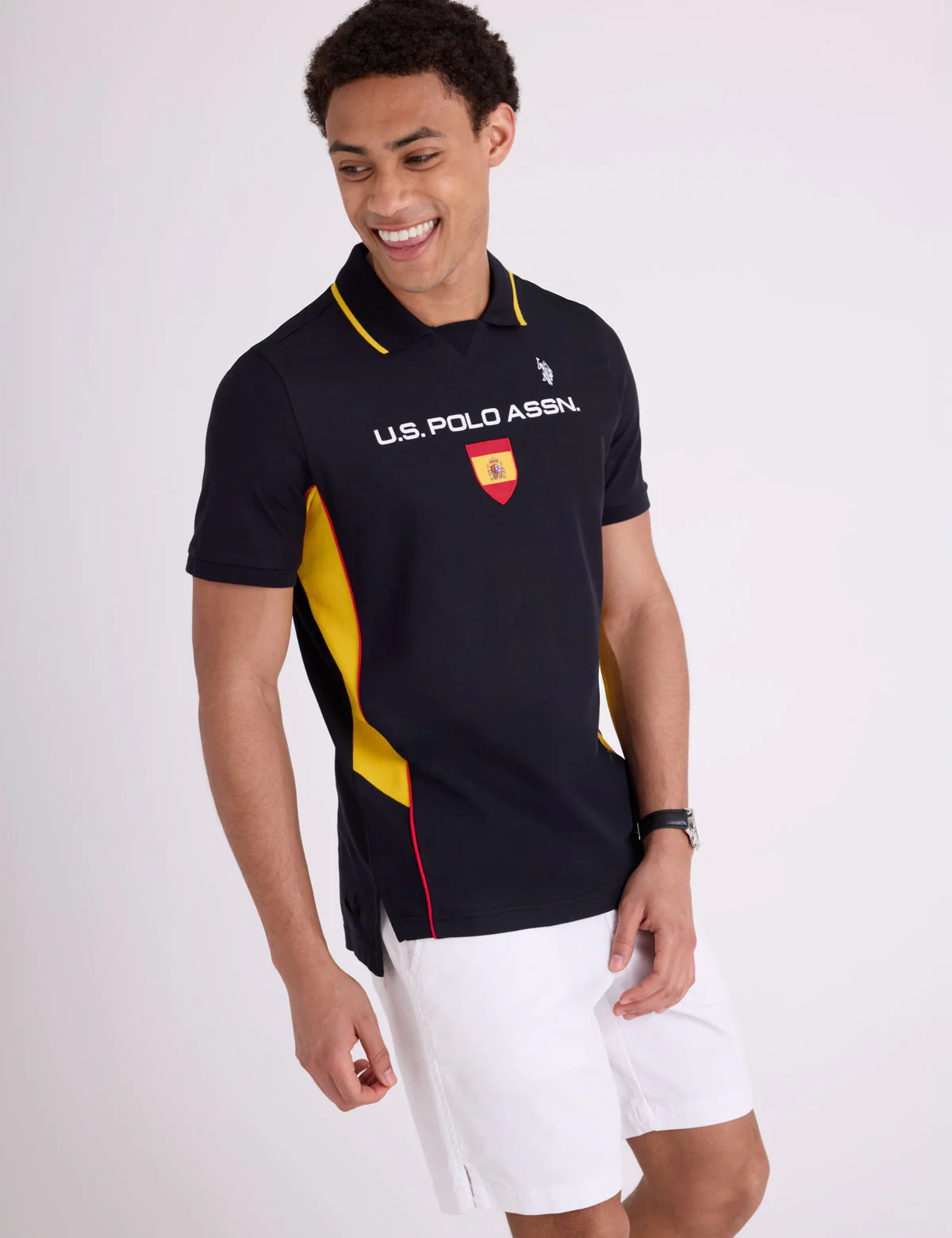 1095-spain-shield-performance-pique-polo-shirt-1.webp SPAIN SHIELD PERFORMANCE PIQUE POLO SHIRT