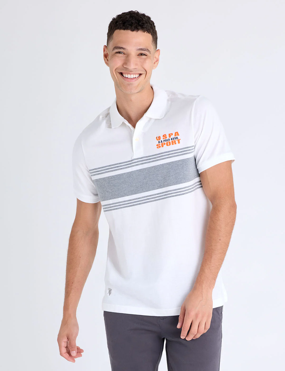 12926-uspa-sport-engineered-stripe-polo-shirt-1.webp USPA SPORT ENGINEERED STRIPE POLO SHIRT