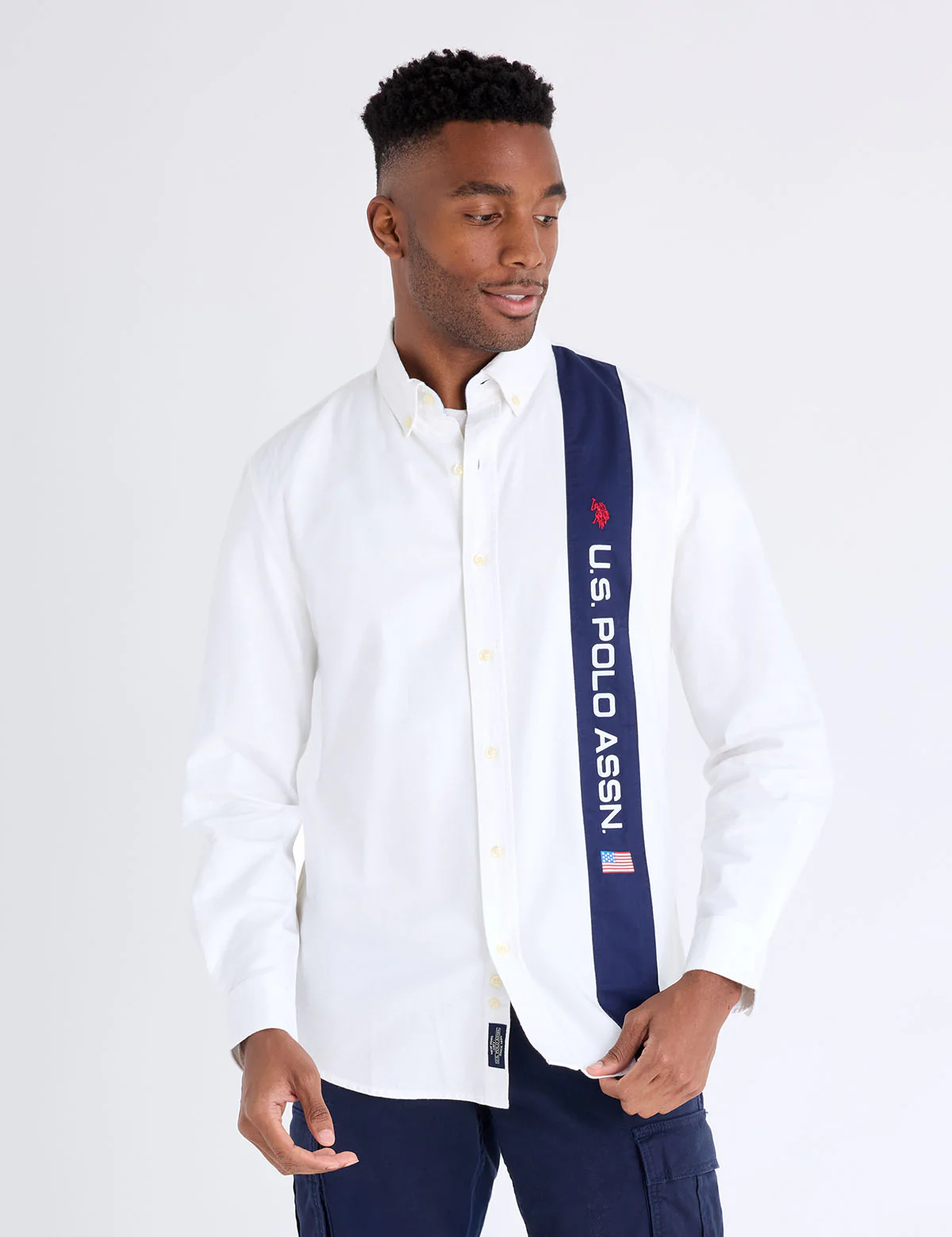 13277-long-sleeve-vertical-wordmark-oxford-shirt-1.webp LONG SLEEVE VERTICAL WORDMARK OXFORD SHIRT
