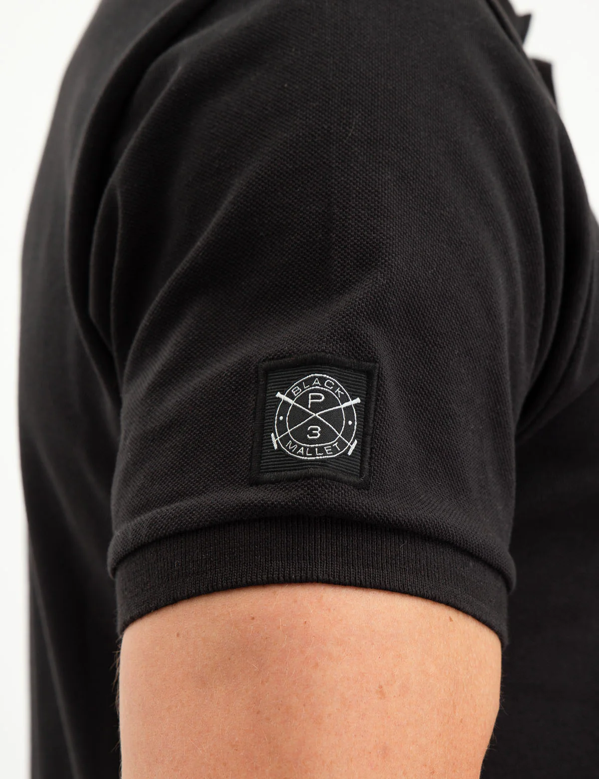 22364-black-mallet-vertical-logo-polo-shirt-12.webp BLACK MALLET VERTICAL LOGO POLO SHIRT