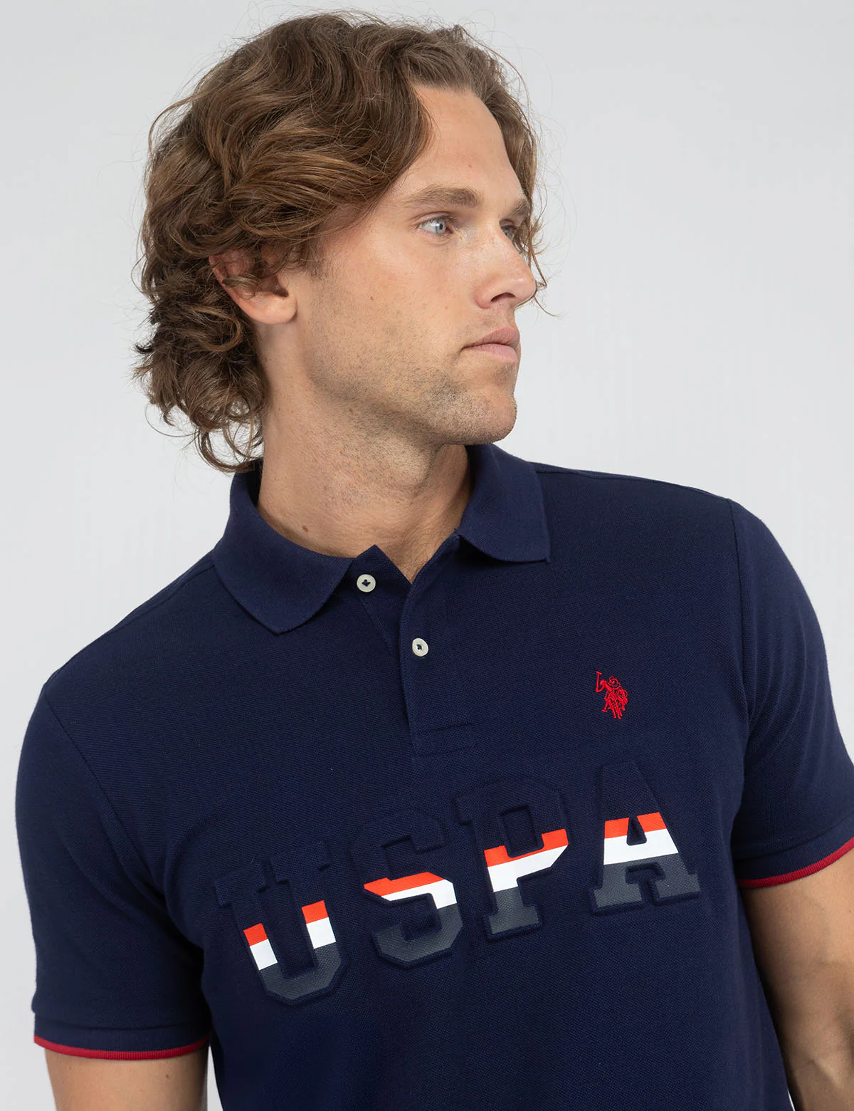 9384-uspa-embossed-pique-polo-shirt-1.webp USPA EMBOSSED PIQUE POLO SHIRT